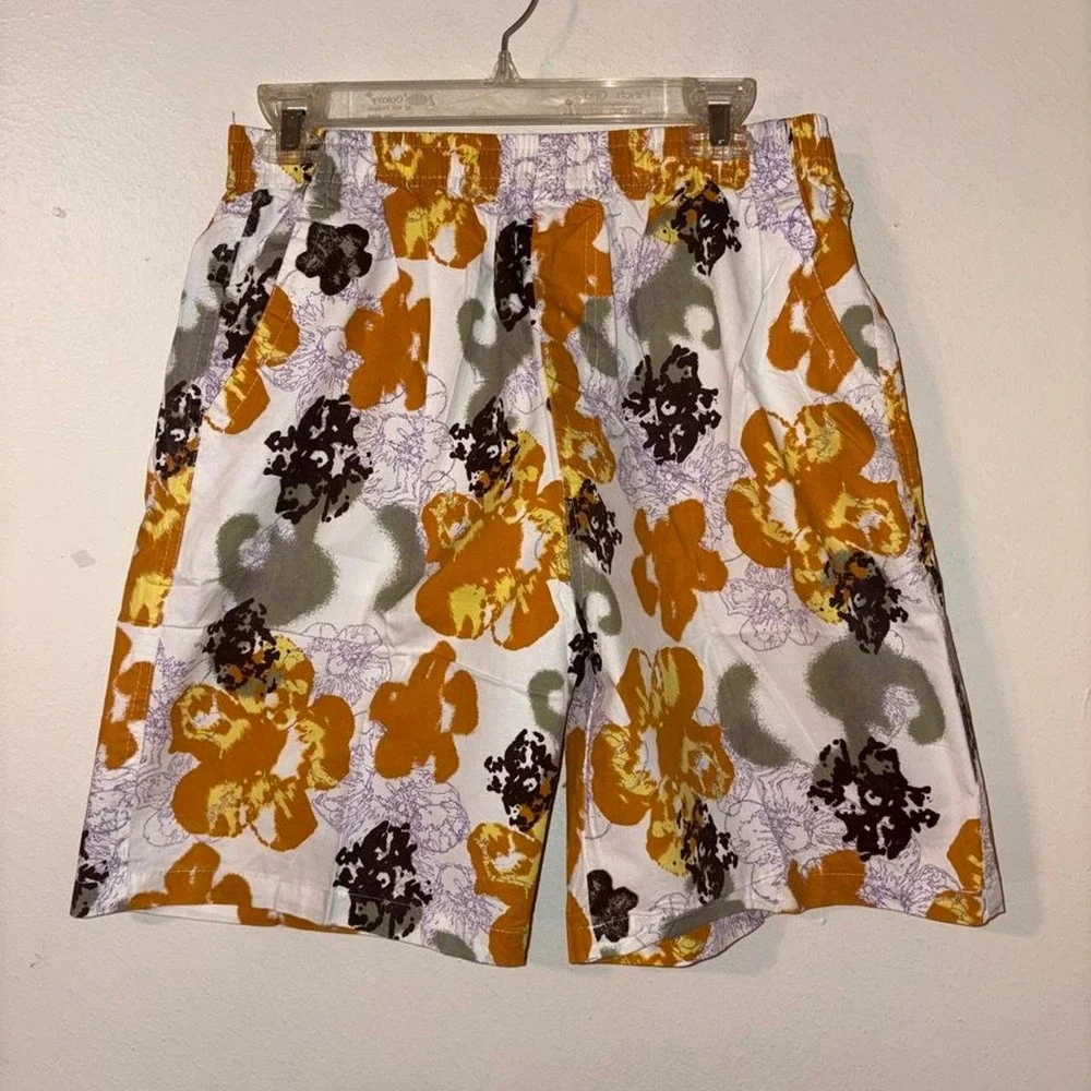 Swim Shorts Orange, black, and purple floral print swim trunks #swimwear #floral